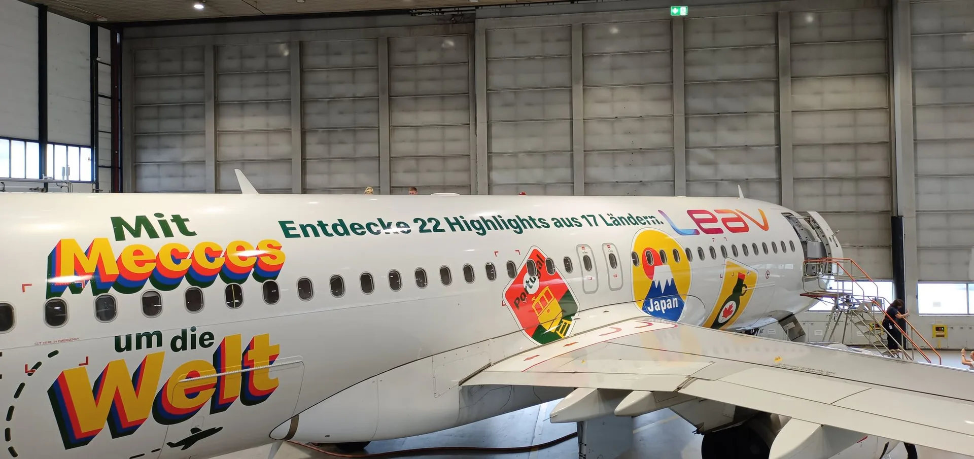 Aircraft in a maintenance hangar during livery work