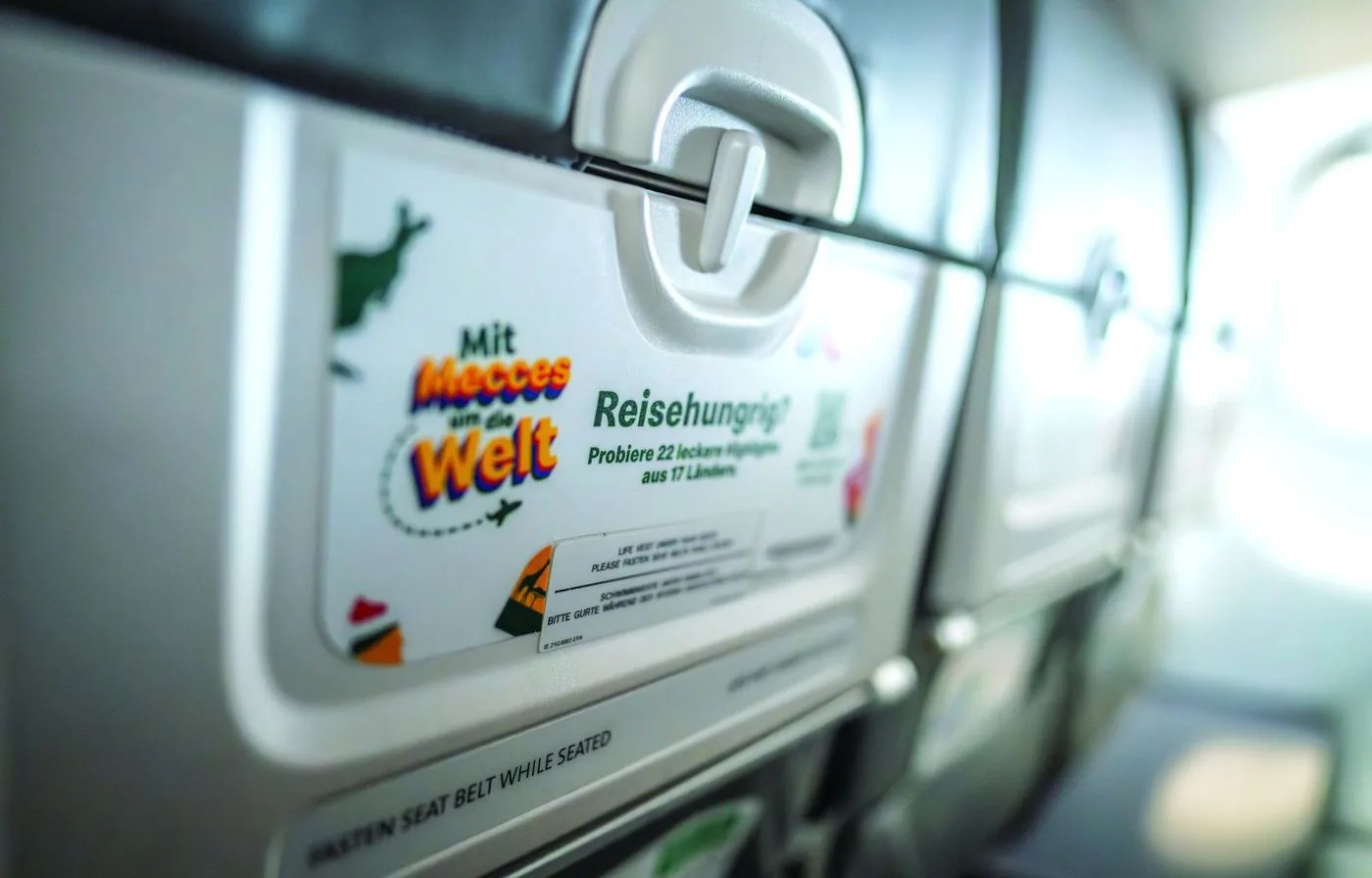 Close-up of a tray table with campaign artwork
