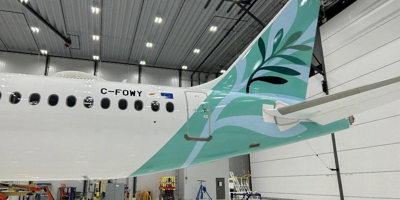 Cyprus Airways Airbus A220-300 in the hangar at Airbus Canada, still on its Canadian registration C-FOWY