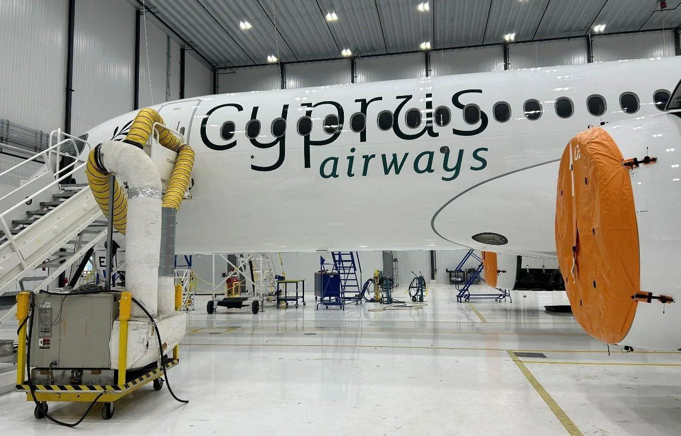 Cyprus Airways titles on the fuselage during application in the assembly hall