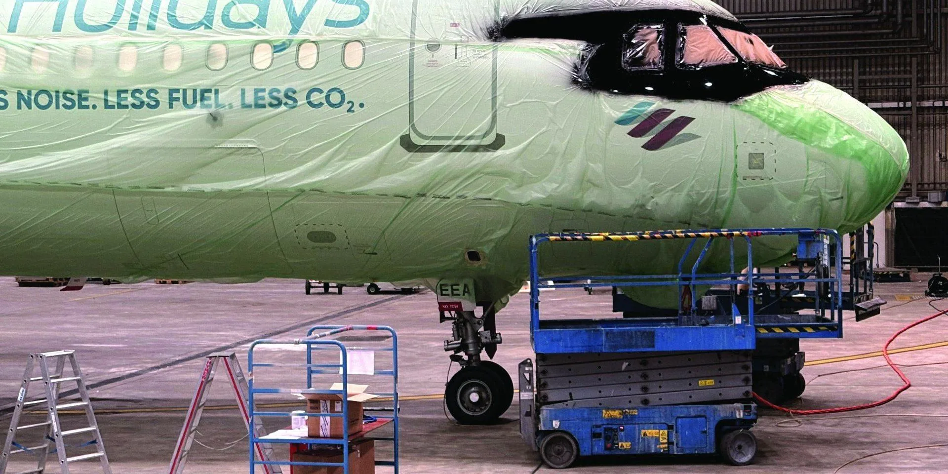 Eurowings A321neo D-AEEA in the hangar with the painted sunglasses cockpit design and access platforms