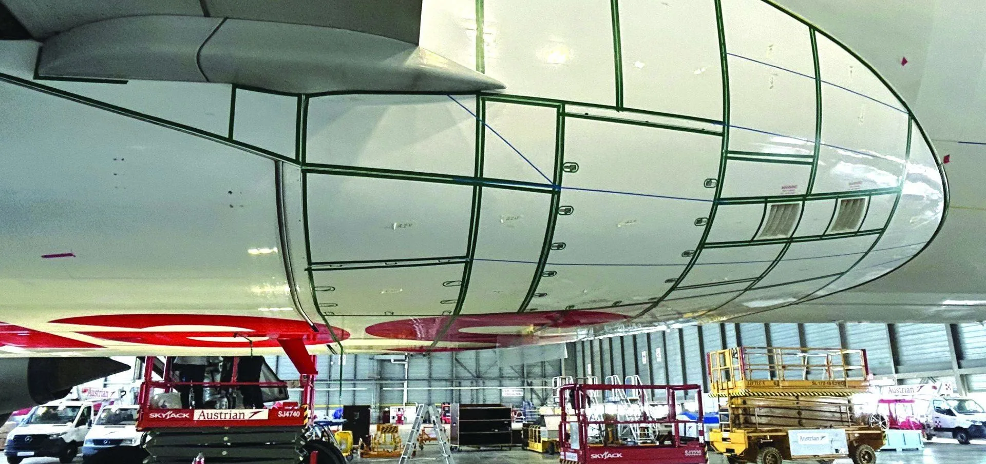 Widebody aircraft in a maintenance hangar during surface work